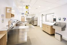 an empty hospital room with stainless steel appliances