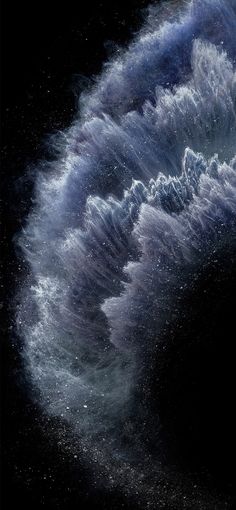 an image of the back side of an iphone with water swirling around it and stars in the background