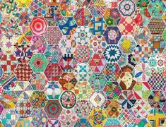 a very colorful quilt with many different designs