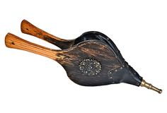 a wooden bird with black leather and gold accents