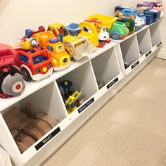 toy cars are lined up on the shelves in this playroom for children to learn how to use them