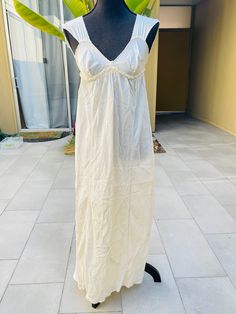 "50s Silk Long Full Slip Dress Vintage Flowing Nightgown Scalloped Edge Appears handmade Ties in back and goes all the way around just below the bust Great condition, one very small stain on the back..nothing major by any means but worth mentioning..I've included close up pictures of the stain Measures (laying flat): 16\" pit to pit and 50\" long See pictures for additional details" Vintage V-neck Sleep Dress, Cream V-neck Sleep Dress, Empire Waist Dress For Wedding Night In Summer, Vintage V-neck Nightgown For Loungewear, Cotton Maxi Dress With Empire Waist For Daywear, Sleeveless Cotton Nightgown For Wedding Night, Vintage Cotton Nightgown For Summer, Cotton Sleeveless Nightgown For Wedding Night, Vintage Cream Sleeveless Sleepwear