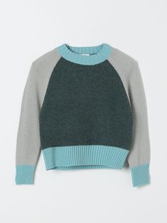 a green and grey sweater is hanging on a hanger