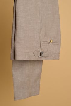 A bespoke suit crafted from a beautiful lighweight "triple-blend" fabric comprised of wool, linen and silk. The wool gives it lasting performance and smooth drape, the linen gives it texture and breathability, and the silk gives it a unique luster with a subtle iridescent sheen unlike any other fabric. Timeless Beige Linen Suit, Fitted Linen Blazer With Flat Front, Luxury Linen Suits For Workwear, Classic Linen Suit With Single Button, Tailored Linen Suit With Pressed Crease, Tailored Beige Linen Suit, Fitted Linen Suits For Work, Fitted Beige Linen Suit, Beige Linen Blazer With Pressed Crease