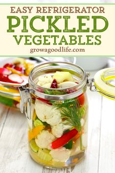 a jar filled with pickled vegetables on top of a table