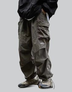 Green Parachute Pants Techwear Parachute Pants With Functional Pockets For Outdoor Activities, Urban Baggy Parachute Pants For Winter, Baggy Urban Parachute Pants For Winter, Winter Cargo Pocket Parachute Pants For Outdoor Activities, Winter Outdoor Parachute Pants With Cargo Pockets, Techwear Parachute Pants With Multiple Pockets For Outdoor, Winter Functional Cargo Pants For Streetwear, Urban Pants With Multiple Pockets For Outdoor Activities, Techwear Pants With Pockets For Outdoor Activities