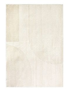 a white rug with circles and lines on the floor in front of a white background