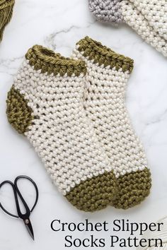 crochet slipper socks pattern with scissors and yarn