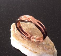 Copper Ring - This is a handmade pure copper ring with a 3/16 inch wide band that can be adjusted to fit all fingers and thumb very comfortably.  I annealed and twisted a new piece of 10 gauge pure copper wire, hammered it uniformly for a perfect texture and formed it into the desired size ring.  After shaping for a perfect fit, it was tumbled in a jewelers mix to polish for a beautiful bright shine and a smooth comfortable wear.  It's a simple design that will slide on to your finger and over j Copper Ideas, Copper Properties, Coil Ring, Indira Gandhi, Ring Man, Iron Ring, Celtic Rings, Wave Ring, Copper Ring