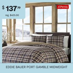 a bed with plaid sheets and pillows on it for $ 138 99 reg $ 240 00