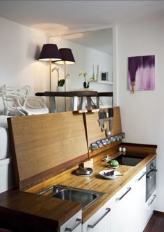 a tiny apartment with a medical disapening kitchen on the appliance