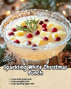 a white christmas punch with pineapples and cranberries