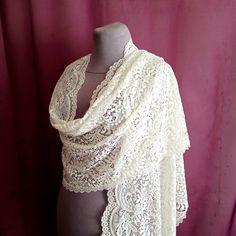 A large ivory scarf is made of amazingly soft and high-quality solid elastic lace. The edges of the scarf are trimmed with a lace border. Delicate ivory shawl has a rectangular shape. The dimensions of the scarf are 75 x 18 inches (182 x 47 cm). It is possible to make a mantilla according to the dimensions you specify. The shawl will be a wonderful gift. Color rendering may differ depending on the monitor settings. I sew unique shawls in small batches, by hand and exclusively for you. The scarf Elegant Lace Shawl Scarves, Lace Shawl Scarf For Weddings, Lace Shawl With Lace Trim For Wedding, Lace Wedding Scarf Shawl, Elegant Cream Lace Shawl, Lace Shawl Scarves For Wedding, Lace Shawl For Weddings, White Lace Shawl With Lace Work, Wedding Shawl With Lace Trim