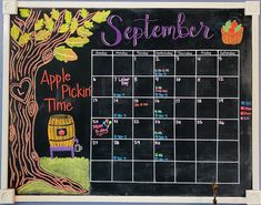 a chalk board with an apple picking time calendar on it