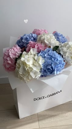 a bouquet of flowers in a white box