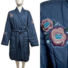 From Gudrun Sjoden Quilted Puffer Type Coat With Sash Belt Kimono Style With Wider Sleeve Crossover Front With Single Button Large Pouch Pockets On Front Beautiful Blue Color With Embroidered Floral Appliques On Right Chest And Both Sleeves Contrasting Gray Lining Inside **See Pic Of Jacket Folded For Thickness Not Heavy -- Fluffy Light Puffer Style Excellent Pre-Owned Condition With No Significant Flaws To Note Size Large. Not Stretchy. Shown On Size Small Mannequin (She Is About A Us Size 2/4) Measurements (Taken Flat): Across Chest Pit To Pit 25.5”, Across Shoulders At Upper Back 27” (Dropped Shoulder Seam), Sleeve From Shoulder To Edge Approx 22” (This Is A Long Sleeve I Am Quilted Kimono, Fluffy Light, Belt Kimono, Small Mannequin, Puffer Style, Gudrun Sjoden, Large Pouch, Sash Belt, Kimono Style