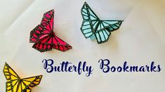 three paper butterflies with the words butterfly bookmarks written below them on a white background