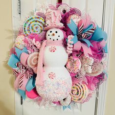 a wreath with a snowman on it