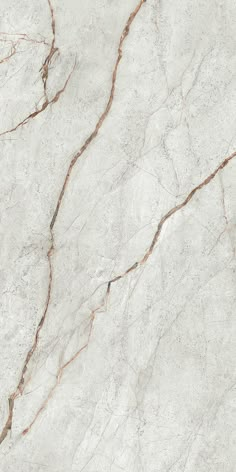 white marble textured with brown vein lines