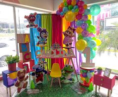 a birthday party with balloons and decorations