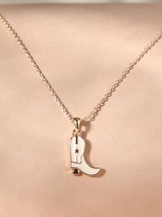 This necklace showcases a miniature cowboy boot pendant, embodying the spirit of the wild west. Crafted with attention to detail, this accessory adds a touch of Western charm to any outfit. Country Necklaces, Country Necklace, Horse Necklace, Wedding Branding, Camera Icon, The Wild West, Western Jewelry, Cowboy Boot, Plus Size Shopping