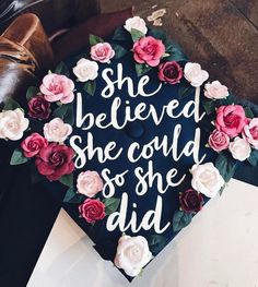 a graduation cap decorated with flowers and the words she beliveed she could so she did