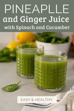 pineapple and ginger juice with spinach and cucumber in glasses on a counter