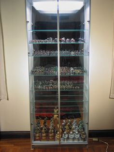 a glass case filled with lots of small toys