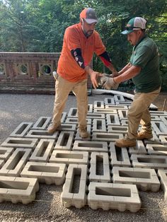 two men standing on top of a maze