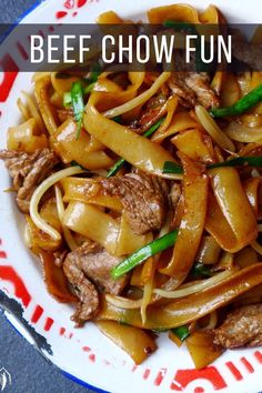 a white plate topped with noodles and meat