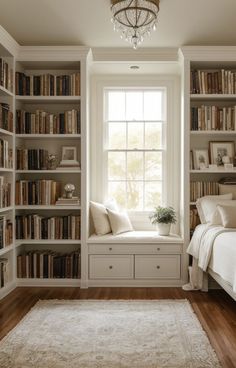 a bedroom with lots of bookshelves and a bed in front of the window