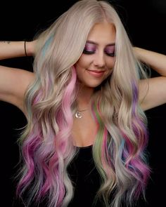 Experience a playful dance of pastel highlights in this enchanting hairstyle. Lavender, mint green, and sky blue hues gracefully intermingle with a platinum blonde base. Flowing waves and long layers create a whimsical yet chic look. Ready to add a touch of fairy-tale charm? Click for more and follow us on Pinterest! ** Photo Credit: Instagram @vividlyliv Pravana Hair Color, Pastel Highlights, Style Transformation, Blonde With Pink, Fairy Hair