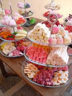 a table topped with lots of different types of desserts