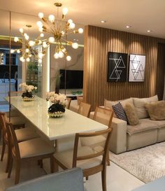 a living room filled with furniture and a white table