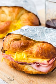 a ham and cheese croissant wrapped in tin foil