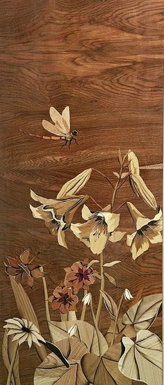 a painting of flowers and butterflies on a wooden surface with wood grain in the background