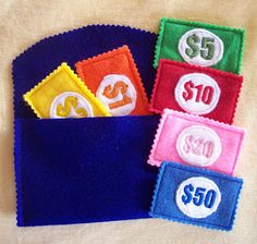 four different colored patches with numbers in the pocket on a white cloth background, one for $ 50 and one for $ 20