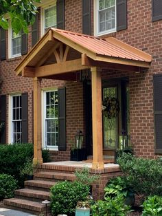 a house with a covered porch and steps leading to the front door