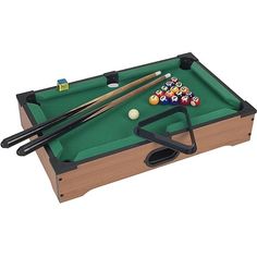 the pool table is set up with cues and balls