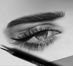 a pencil drawing of an eye with long lashes and eyelashes on top of the image