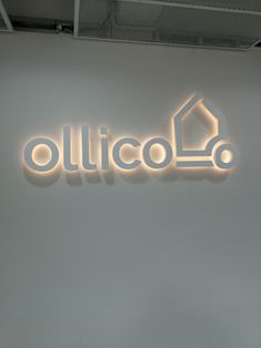 the illuminated sign above the entrance to an office