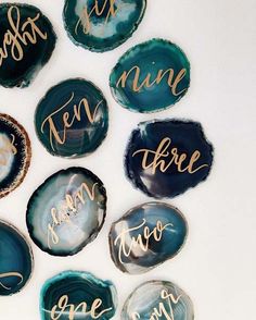 some blue and white plates with gold lettering on them are arranged in the shape of hearts