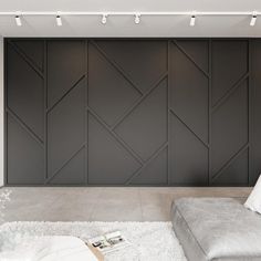 a modern living room with white and gray decor on the walls, carpeted flooring and wall lighting