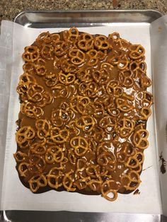 there is a square shaped pretzel covered in caramel