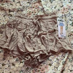 These Are An Xs Tan Ruffle Shorts From Rewash, They Are Nwt And Have A Tie At The Waist Short Cotton Bottoms With Ruffles, Casual Summer Bloomers With Elastic Waistband, Casual Cotton Bloomers With Ruffles, Spring Beach Bloomers With Ruffles, Stretch Cotton Shorts With Ruffles, Stretch Cotton Ruffle Shorts, Stretch Ruffle Cotton Shorts, Stretch Cotton Ruffled Shorts, Trendy Cotton Ruffle Shorts