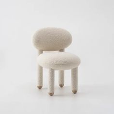 a white chair with two legs that are stacked on top of each other, in front of a white background