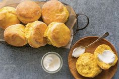 some biscuits and cream are sitting on a table