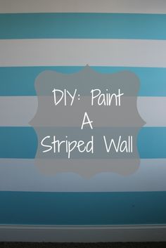 a striped wall with the words diy paint a striped wall in white and blue