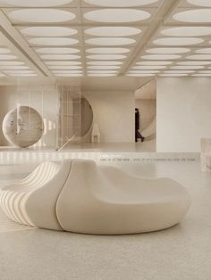 a large white sculpture sitting in the middle of a room