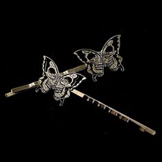 Pieces are attached using a special jewelry adhesive. Please read descriptions thoroughly for sizes and materials.  This is a set of 2 silver hair pins featuring silver metal butterflies with a skull showing in each one. Each one goes in a different direction, so you can wear them on either side of your head, and are mounted on silver hair pins. Pins are 2 3/4" long, and just over  3/4" wide. Make sure to check out my shop for more hair pins, jewelry, accessories, and all sorts of fun stuff! Please note: I am not responsible for any items lost or damaged in the mail. Please double check your address before ordering, and I recommend purchasing insurance. Please note that a special jewelry adhesive is used to adhere the ornament to the pin. It is very sturdy. Black Skull, Set Of Hair Pins, H Silver Hair Pin, Skeleton Hands, Halloween Hair, Black Skulls, Butterfly Hair, Special Jewelry, Silver Hair, Bobby Pins, Hair Pins